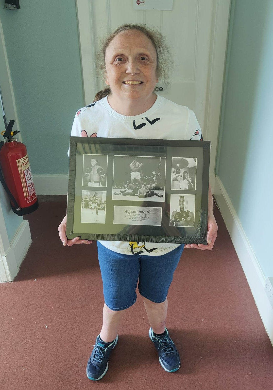 Member Holding Donated Photo